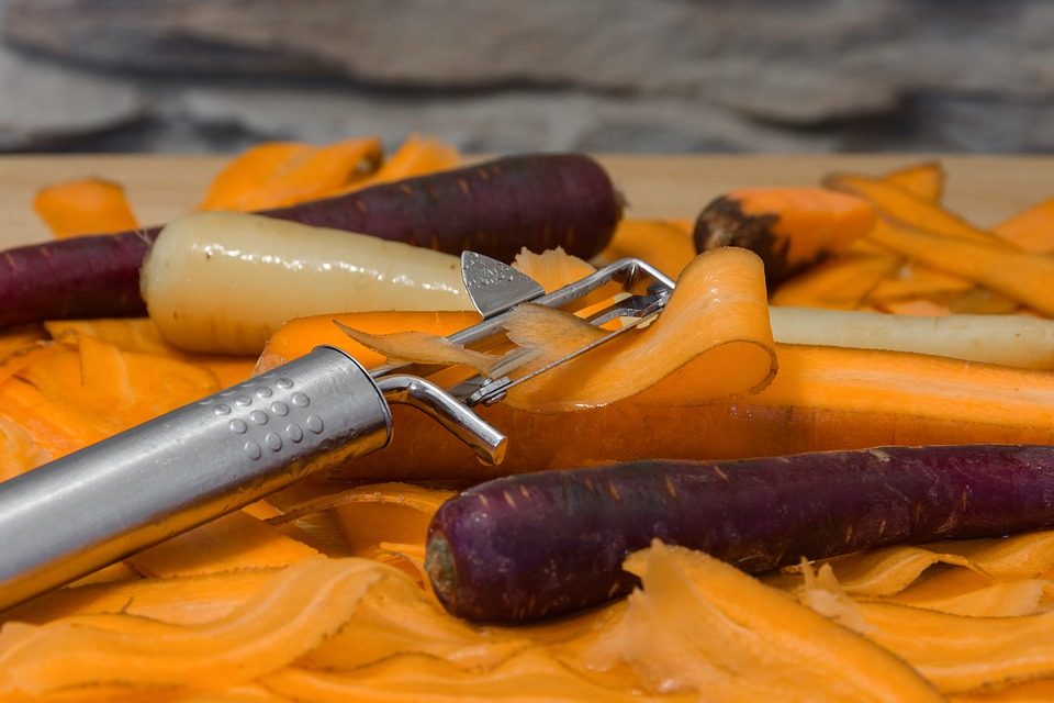Peeling carrots in the kitchen